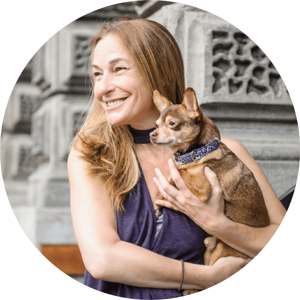 A top level dog training academy graduate, holds her small dog